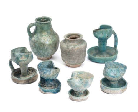 ELEVEN GLAZED POTTERY VESSELS, PERSIA AND MESOPOTAMIA, 9TH-15 CENTURIES comprising five small oil lamps, a jug, a small vase,