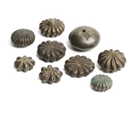 A GROUP OF NINE BRONZE OPIUM WEIGHTS, INDIA, 18TH/19TH CENTURY eight in the form of an amalaka (Indian gooseberry), the other