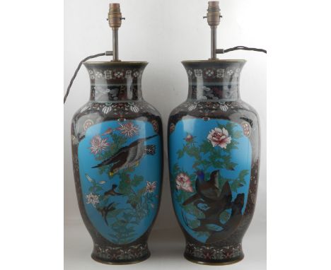 A pair of late 19th / early 20th century Chinese cloisonne vases, modified and wired for electricity, decorated vignettes of 