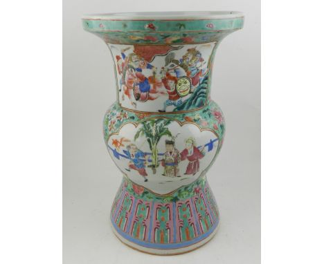 A Chinese hard paste porcelain canton vase, decorated in the famille verte and rose palette having vignettes of figures in la