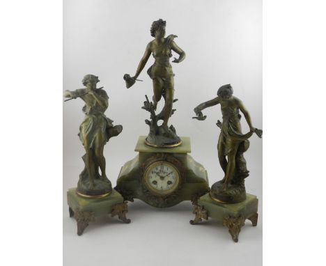 A mid 19th Century French gilt spelter and green onyx clock garniture, mounted with figural studies after the antique, the cl