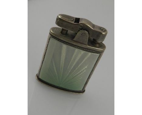 A Ronson cigarette lighter, having engine turned panels decorated with Eau de Nile green guilloche enamel. 