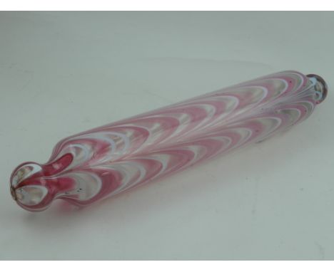 A 19th century nailsea glass rolling pin, with white opaque and pink canes.