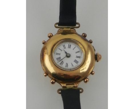 An early 20th century French 18 carat yellow gold ladies cocktail watch, the Roman enamel dial with outer minute track, set m