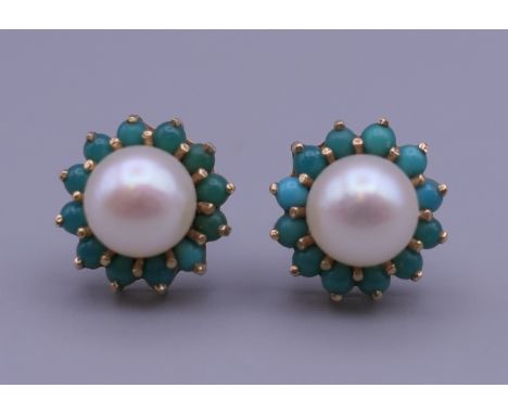 A pair of 9 ct gold turquoise and pearl earrings, each with replaced silver backs. 1 cm diameter. 