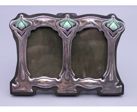 An Art Nouveau style silver double photograph frame. 11 cm wide.