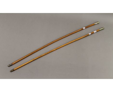 Two swagger sticks, one for the Suffolk Regiment and the other The Royal Army Ordnance Corps. The latter 68.5 cm long.