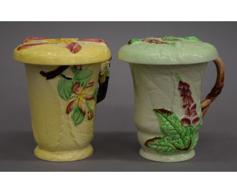 Two Carltonware porcelain chocolate cups with lids. 11 cm high.