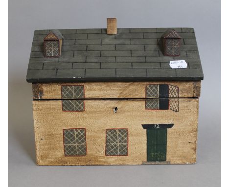 A wooden tea caddy in the form of a house. 26 cm wide.