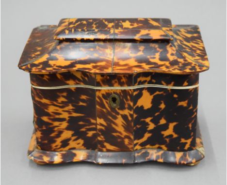 A 19th century tortoiseshell tea caddy. 16.5 cm wide.