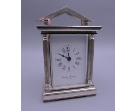 A modern silver cased Charles Frodsham miniature carriage clock. 10 cm high.