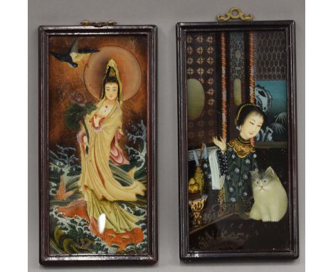 A pair of Chinese reverse painted glass portrait paintings, framed. 30 cm high.