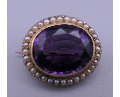 A Victorian amethyst and pearl brooch. 2.2 cm wide. 6.2 grammes total weight.
