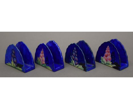 A boxed set of four Carltonware delphinium pattern napkin rings.
