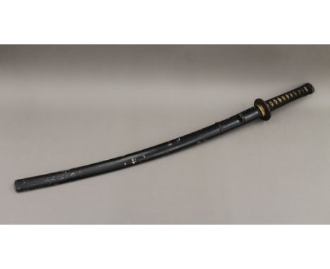 A Japanese katana in scabbard. 95 cm long.