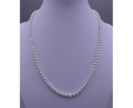 A pearl necklace with a diamond set 15 ct gold clasp. Approximately 43 cm long.