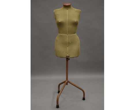 A vintage Singer mannequin. 138 cm high.