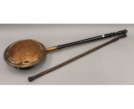 A vintage walking stick and a warming pan. The former 91 cm long.