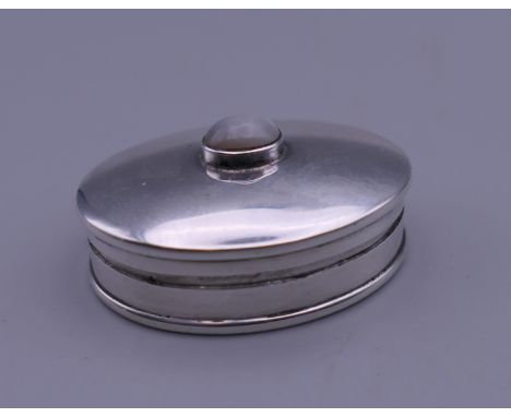 A moonstone set silver snuff box. 3 cm wide.
