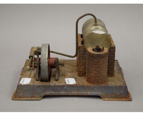 A vintage model stationary steam engine. 20 cm wide.