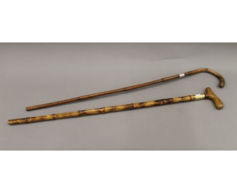 A Victorian bamboo sword/prodding stick and a bamboo cane. The former 88 cm long.