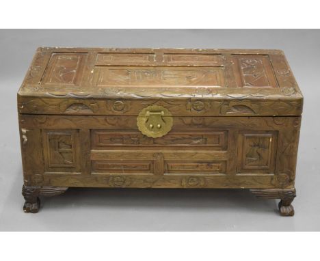 An Eastern carved camphor wood trunk. 68.5 cm wide.