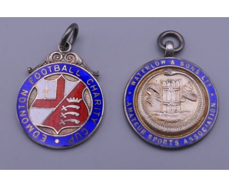 Two 1930s enamel and silver fobs. 