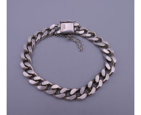 A silver curb bracelet. Approximately 18 cm long. 37.5 grammes.