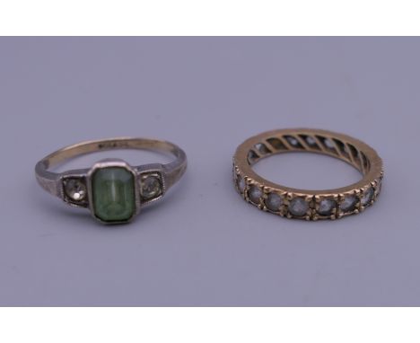 A 9 ct gold and silver green stone ring, and an eternity ring. 