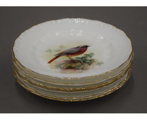 Six small Royal Worcester dishes, each painted with a different bird and signed W Powell. Each 13 cm diameter.
