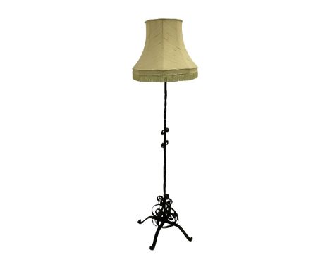 Wrought metal standard lamp with shade