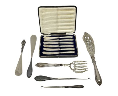 Set of six silver handled butter knives, in case, pair of silver handled fish servers, two silver handled shoe horns, and two