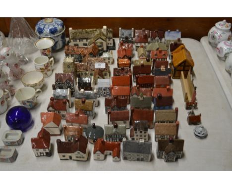 A quantity of Felsham and other pottery model houses, churches and buildings 