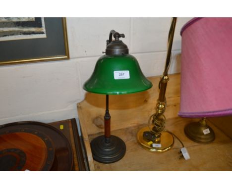 An adjustable reading lamp with green glass shade 