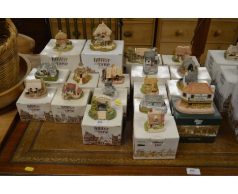 A collection of various Lilliput Lane model cottages and houses with original boxes