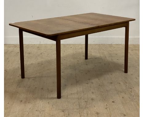 McIntosh of Kirkcaldy, A mid century teak extending dining table, circa 1960's, magic leaf to centre, raised on turned suppor