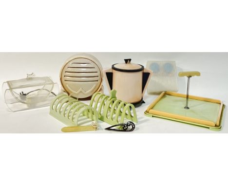 A collection of bakelite/early plastic items, mostly Art Deco style, including a speaker (h- 19cm), two lidded containers, a 