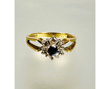 A 18ct gold zircon and diamond cluster ring mounted in claw setting with open sides missing two diamond points N 4.6g&nbsp;