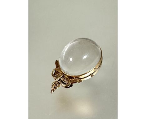 A early 19thc yellow metal mounted oval double sided hinged glass bubble portrait pendant with engraved ribbon knot surmount 