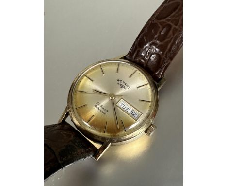 A 9ct gold gents automatic Rotary wrist watch with day and date complication and baton hour markers engraved verso with Bank 