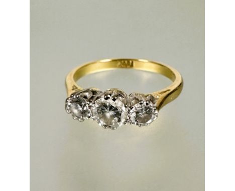 A 18ct gold three stone graduated diamond ring the center stone approximately 0.25ct flanked by 0.15ct in claw setting L/M&nb