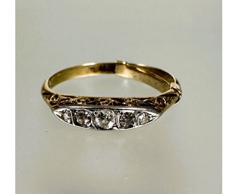 A 18ct gold five old mine cut graduated diamond set ring, the center stone approximately 0.03ct with pierced and engraved sha
