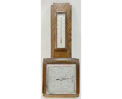 An oak Smith's wall mounting aneroid barometer and thermometer (h- 43cm, w- 16.5cm)