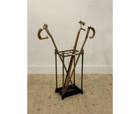 A Victorian brass and cast iron five division stick stand, with urn finials and original drip tray (H63cm) together with a co