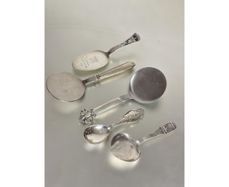 A collection of Danish silver to include and four various shaped pastry/ serving spoons two with stainless steel circular bas