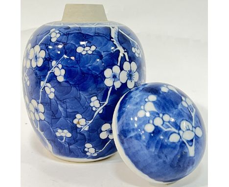 A Qing Dynasty blue and white porcelain prunus blossom pattern ginger jar in the Kangxi taste (Kangxi period or later, double