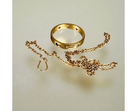 A 9ct gold ring set five clear stones and a Edwardian yellow metal trace link chain section with button clip loop for monocle