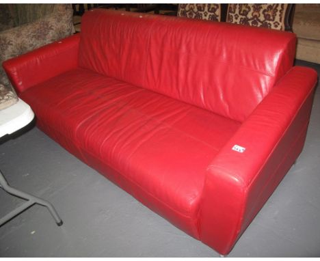 Modern red leather three seater sofa on chrome supports.(B.P. 24% incl. VAT) 