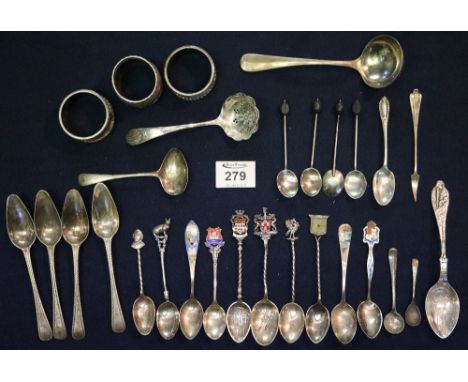 Assorted silver and other white metal cutlery items, napkin rings etc, including various enamel and other souvenir spoons etc