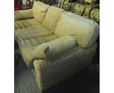 Modern upholstered three seater conservatory sofa with wicker frame, together with a matching foot stool (purchased in Leekes